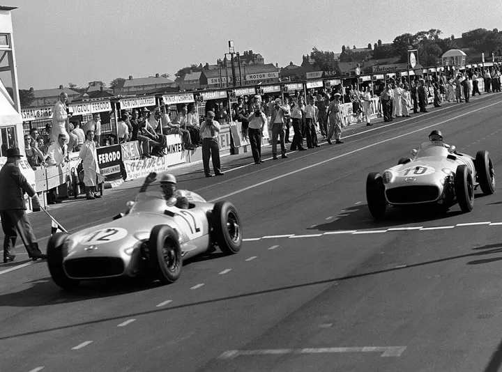 Moss a Fangio, GP Great Britain 1955